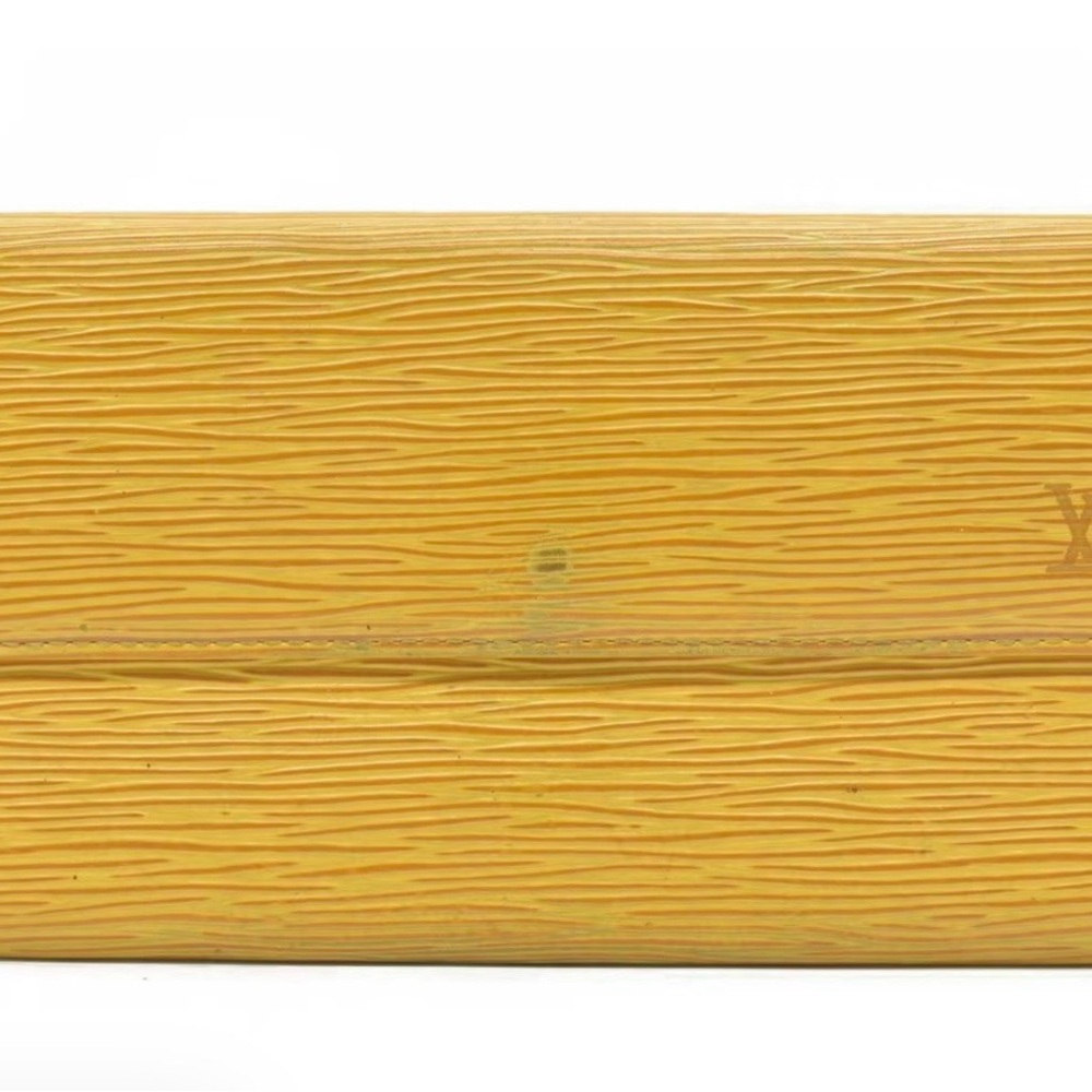 Louis Vuitton Mustard Textured Clutch
